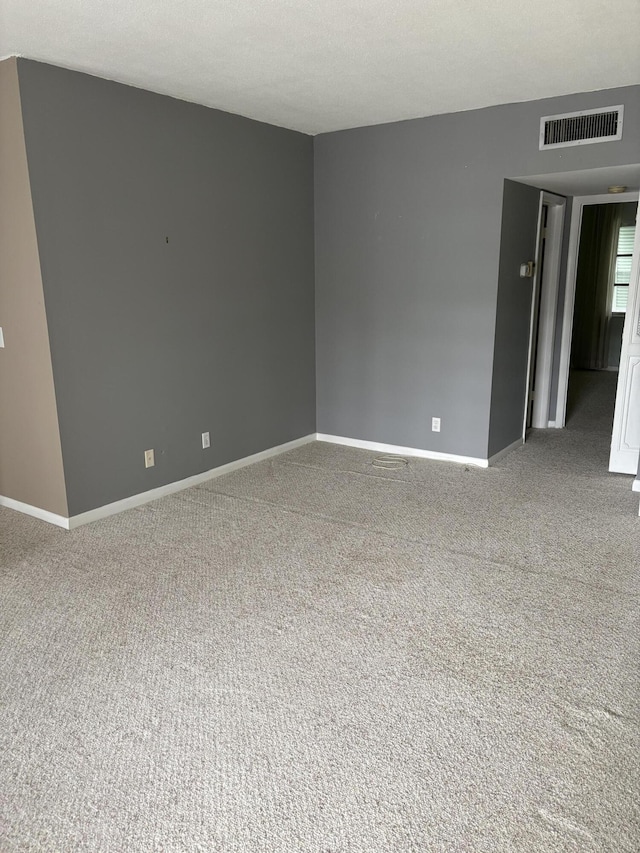 unfurnished room featuring carpet floors