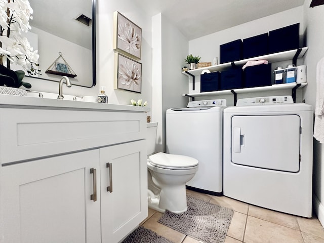 903 9th Ter, Palm Beach Gardens, FL 33418 - bathroom with toilet, tile patterned flooring, vanity, and washer and clothes dryer