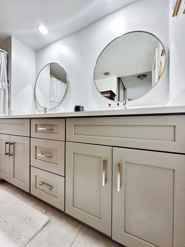 bathroom featuring tile patterned floors and vanity