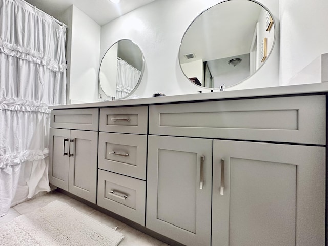 903 9th Ter, Palm Beach Gardens, FL 33418 - full bathroom featuring tile patterned floors, visible vents, and double vanity