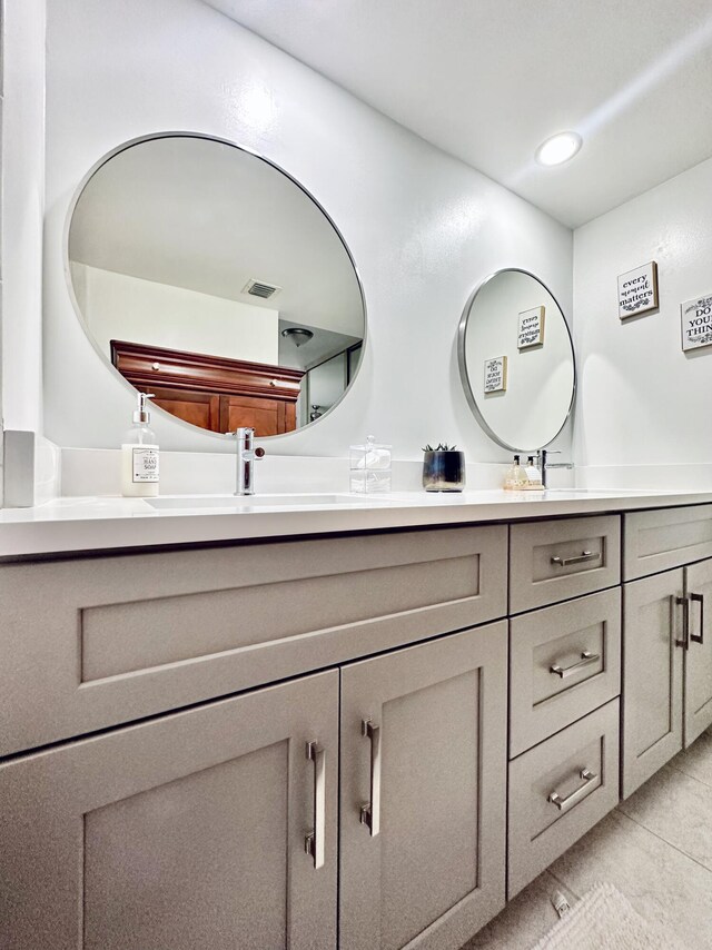 903 9th Ter, Palm Beach Gardens, FL 33418 - bathroom featuring tile patterned flooring, double vanity, a sink, and visible vents