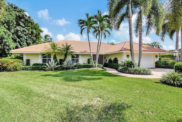 single story home with a front lawn and a garage