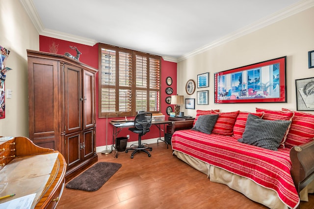 bedroom with ornamental molding and hardwood / wood-style floors