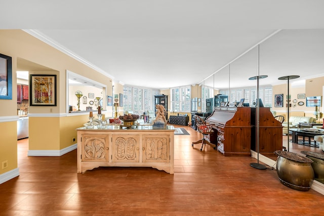 interior space with hanging light fixtures, ornamental molding, and stainless steel dishwasher