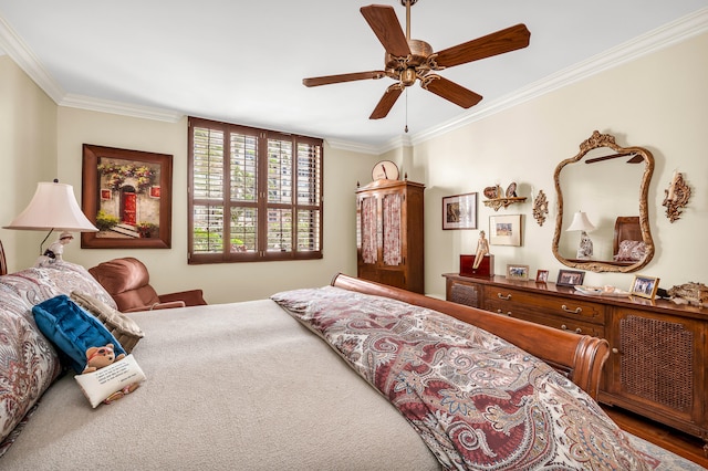 bedroom with ceiling fan and ornamental molding