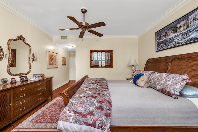 bedroom featuring dark wood-type flooring, ornamental molding, and ceiling fan