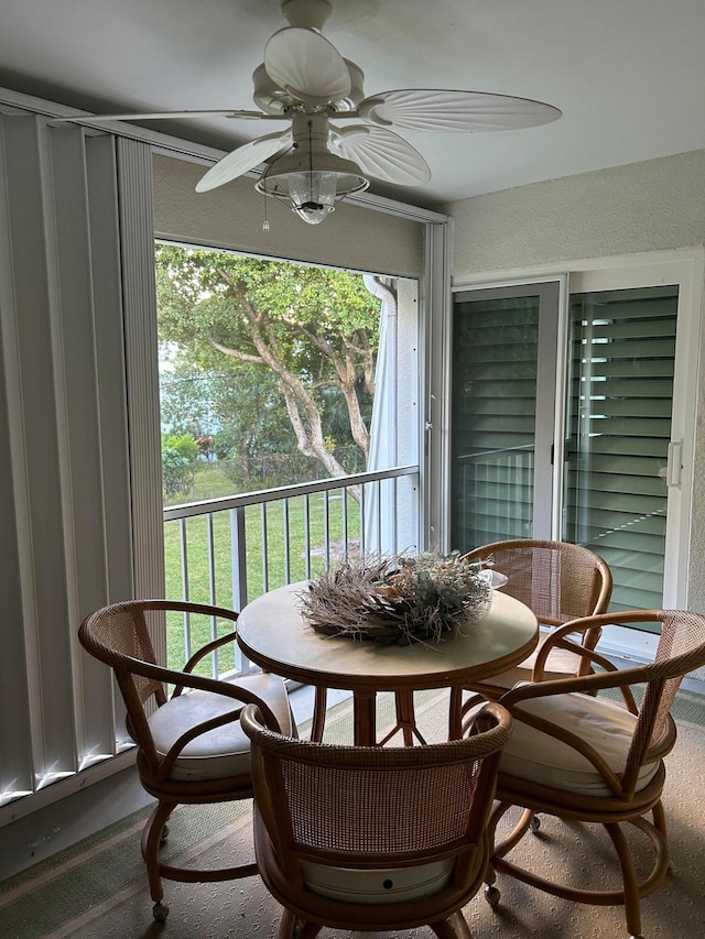 sunroom / solarium with ceiling fan