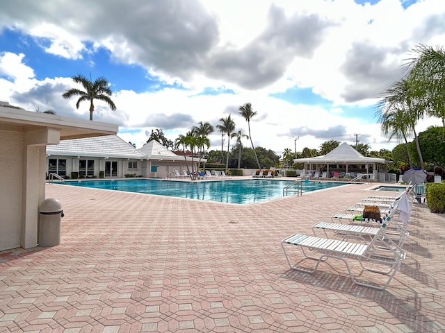 view of swimming pool with a patio area