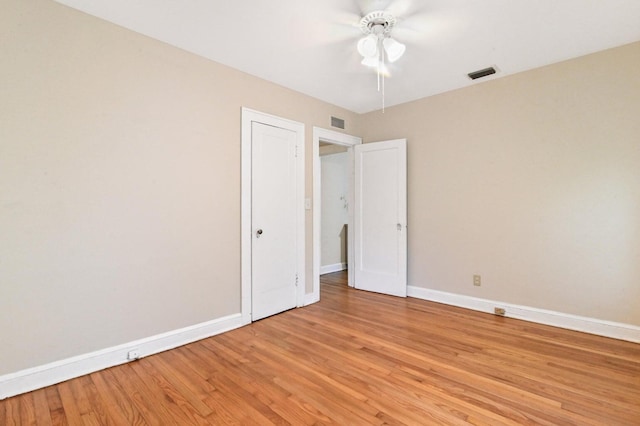 unfurnished bedroom with ceiling fan and light hardwood / wood-style flooring