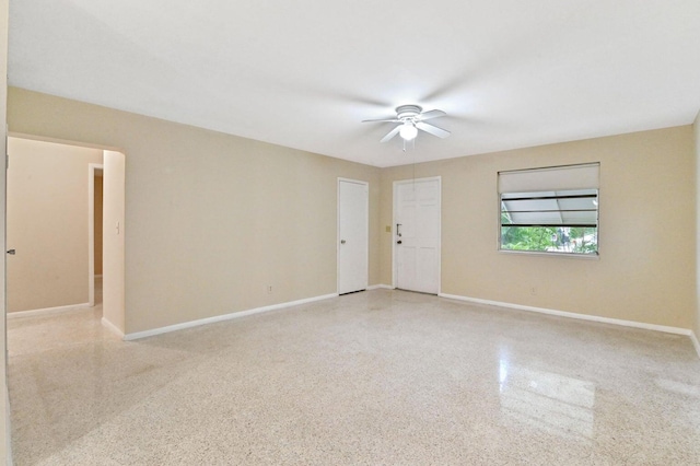 spare room with ceiling fan