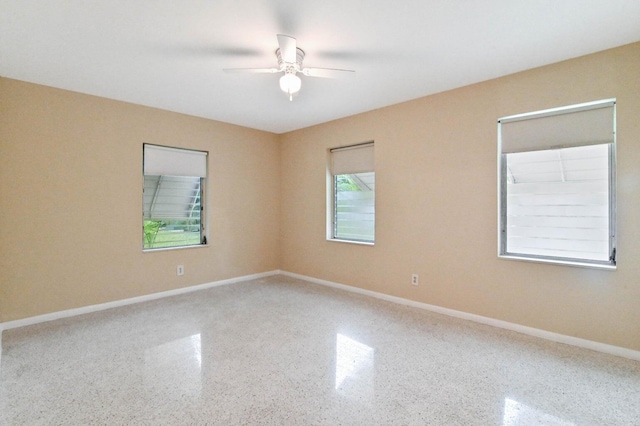 unfurnished room with ceiling fan