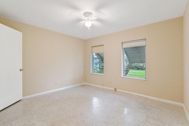 spare room with ceiling fan