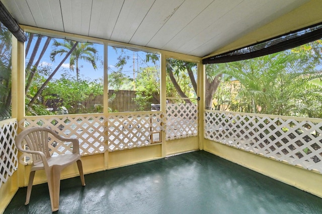 unfurnished sunroom featuring wooden ceiling