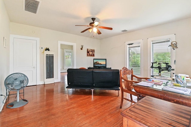 office area featuring wood-type flooring and ceiling fan