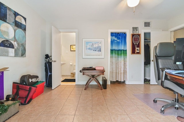 tiled home office with ceiling fan