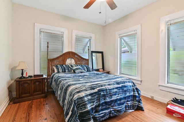 bedroom with ceiling fan and hardwood / wood-style floors