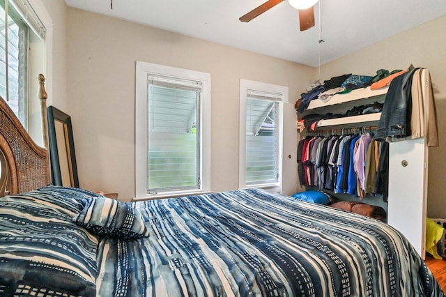 bedroom with ceiling fan and a closet