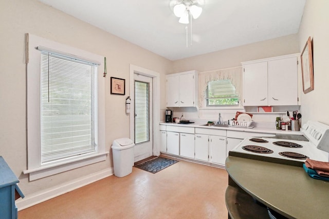 kitchen with white cabinetry, ceiling fan, white range with electric stovetop, and sink