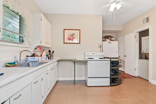 kitchen with white appliances, sink, ceiling fan, and white cabinets