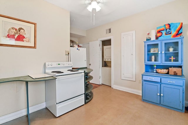 kitchen with blue cabinets, ceiling fan, white appliances, light colored carpet, and stacked washer / drying machine