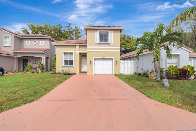 mediterranean / spanish-style house with an attached garage, fence, driveway, stucco siding, and a front lawn