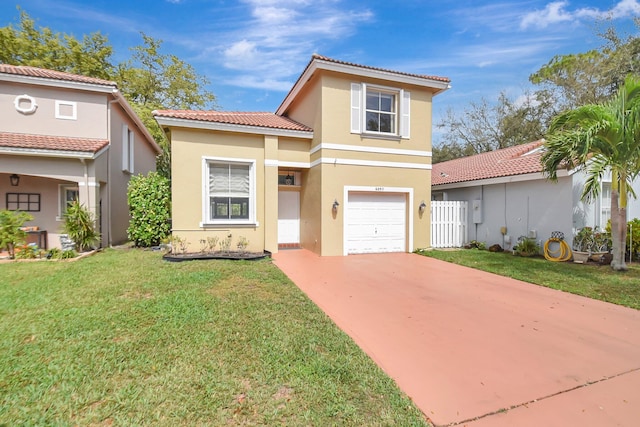 mediterranean / spanish home with an attached garage, concrete driveway, a tiled roof, stucco siding, and a front lawn