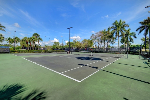 view of sport court with fence