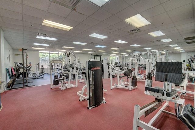 gym with visible vents and a drop ceiling