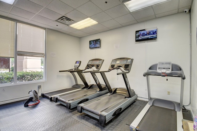 workout area featuring a paneled ceiling and visible vents