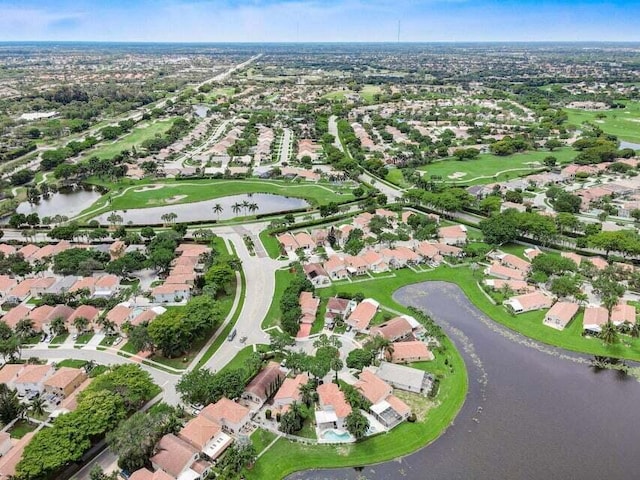 birds eye view of property featuring a water view and a residential view