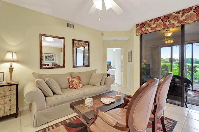 tiled living room with ceiling fan