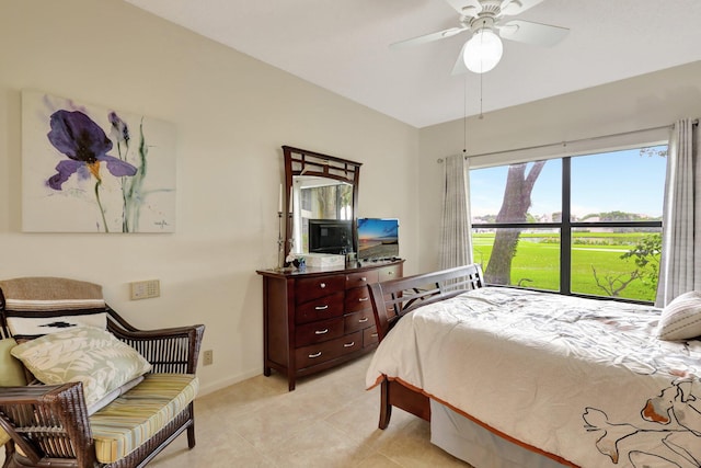 bedroom with ceiling fan and light tile patterned floors