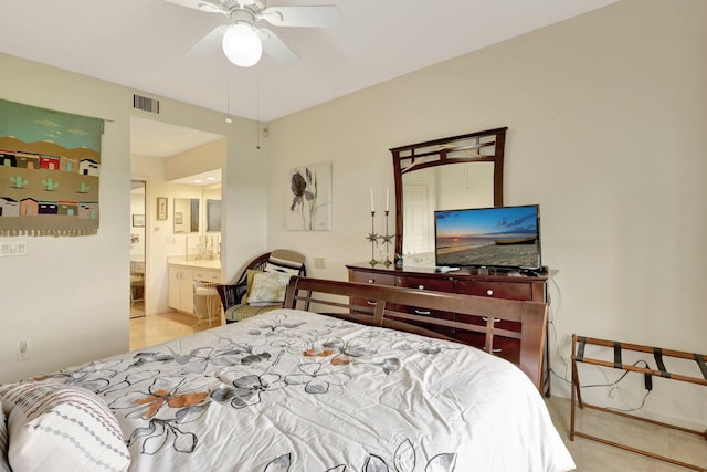 bedroom featuring ceiling fan and connected bathroom