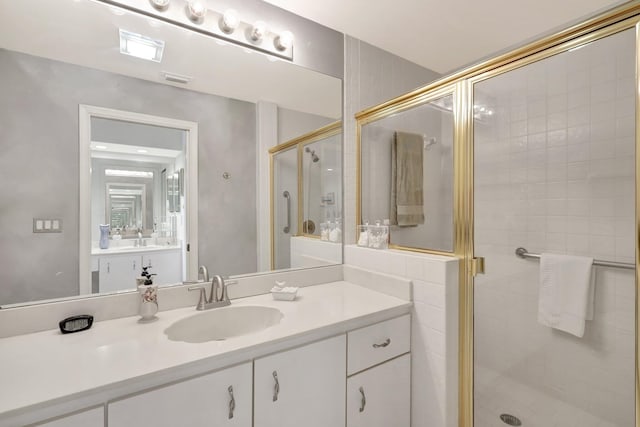 bathroom with vanity and walk in shower