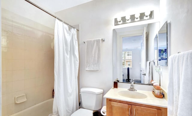 full bathroom featuring vanity, toilet, and shower / tub combo with curtain