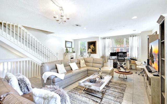 living room featuring an inviting chandelier and light tile patterned floors