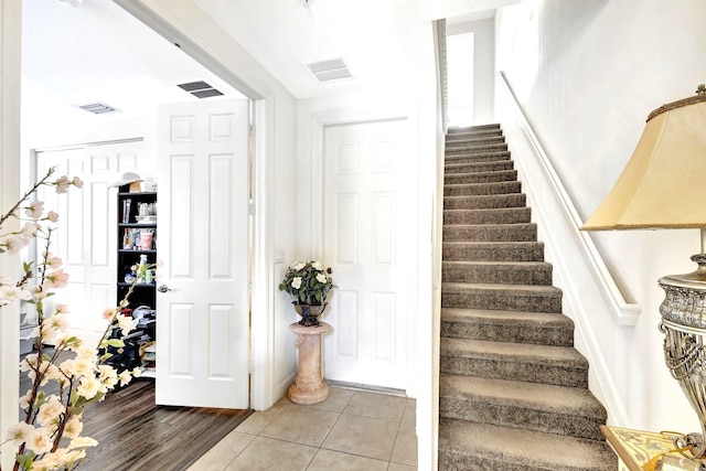 stairway featuring hardwood / wood-style floors