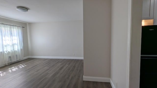 empty room featuring dark hardwood / wood-style floors