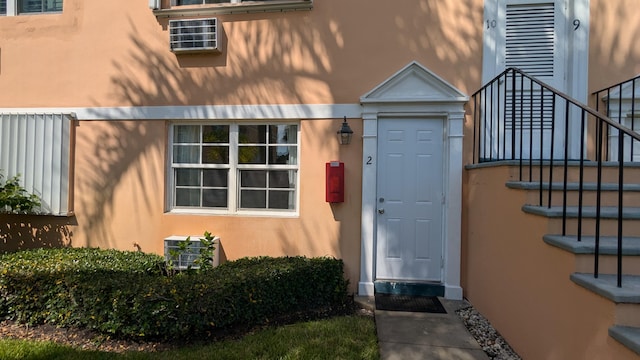 property entrance with an AC wall unit