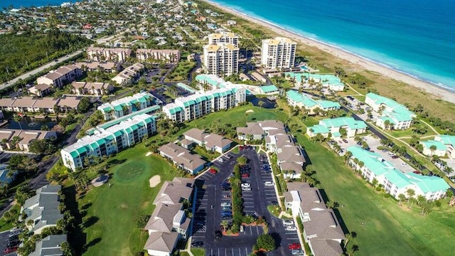 aerial view with a water view and a view of the beach