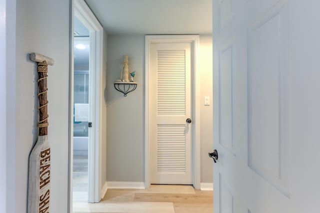 hall with light hardwood / wood-style floors