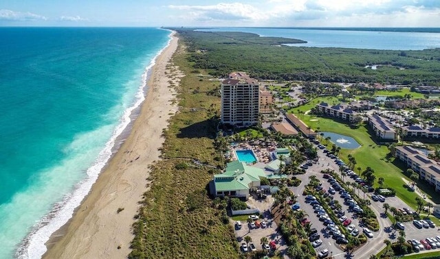 bird's eye view featuring a water view and a view of the beach