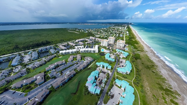 drone / aerial view featuring a view of the beach and a water view