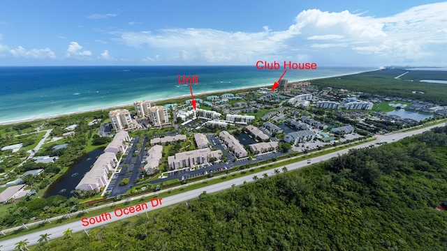 aerial view featuring a beach view and a water view