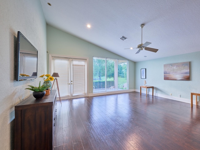 living room with ceiling fan, a textured ceiling, dark hardwood / wood-style floors, and high vaulted ceiling