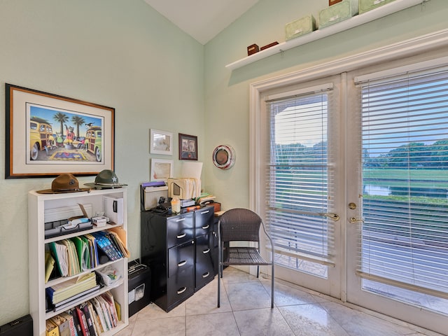 office featuring french doors, light tile patterned flooring, and vaulted ceiling