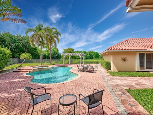 view of swimming pool featuring a patio, a pergola, and an in ground hot tub