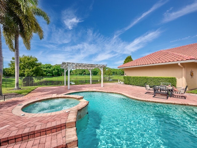 view of swimming pool featuring a pergola, an in ground hot tub, and a patio area