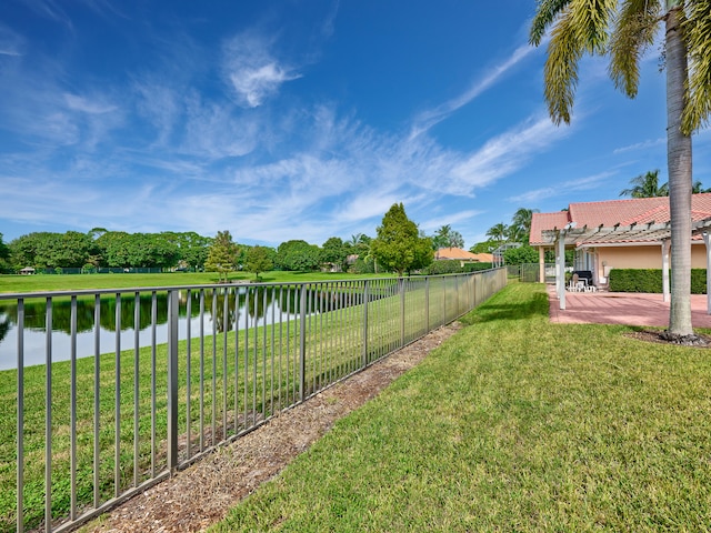 view of yard with a patio and a water view