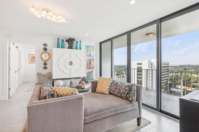 living room featuring expansive windows and light tile patterned flooring